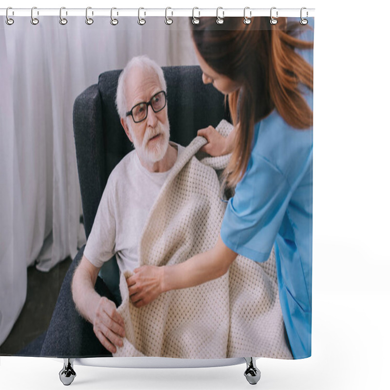 Personality  Caregiver Covering Senior Patient With Plaid Shower Curtains