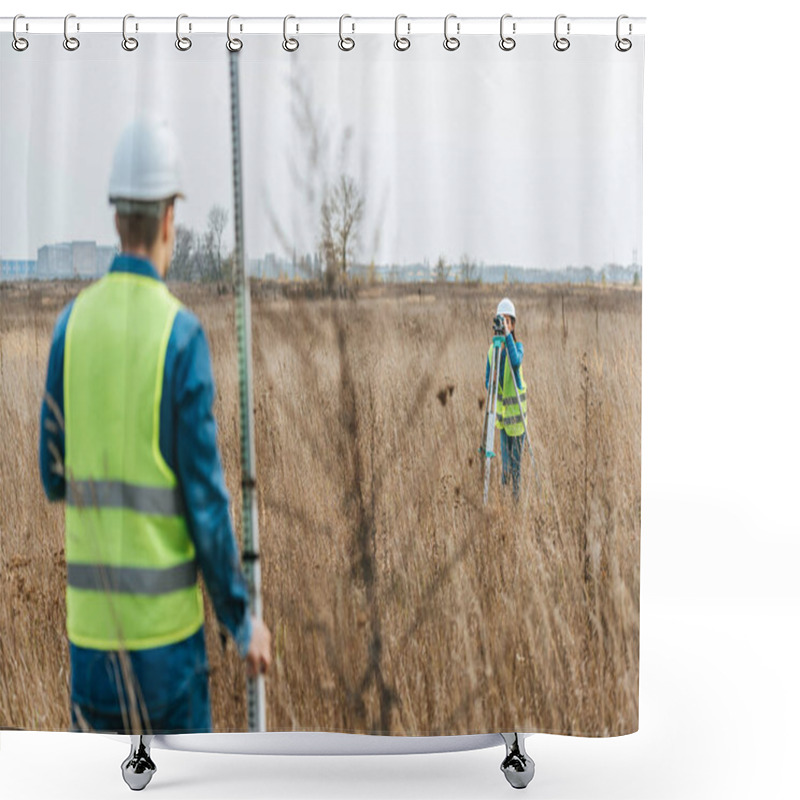 Personality  Selective Focus Of Surveyors Measuring Land With Digital Level And Ruler In Field Shower Curtains