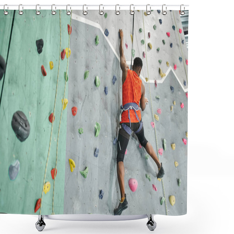 Personality  Back View Of Young African American Man In Orange Shirt Climbing Up Bouldering Wall With Safety Rope Shower Curtains