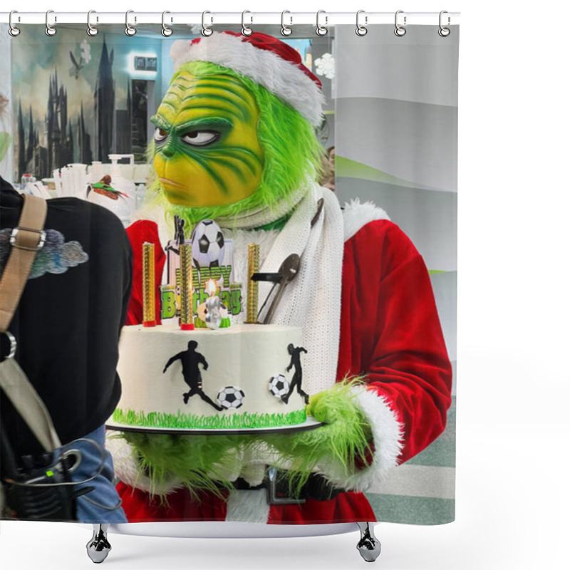 Personality  Kyiv, Ukraine - January 07, 2025: Humorous Scene Of A Green-costumed Character Dressed As Grinch Santa Claus Holding A Soccer-themed Birthday Cake, Creating A Festive And Lively Atmosphere In A Decorated Indoor Setting, Combining Sports And Holiday C Shower Curtains