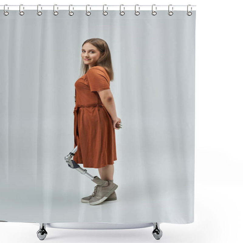 Personality  A Woman With A Prosthetic Leg Stands Confidently In A Brown Dress Against A White Backdrop. Shower Curtains