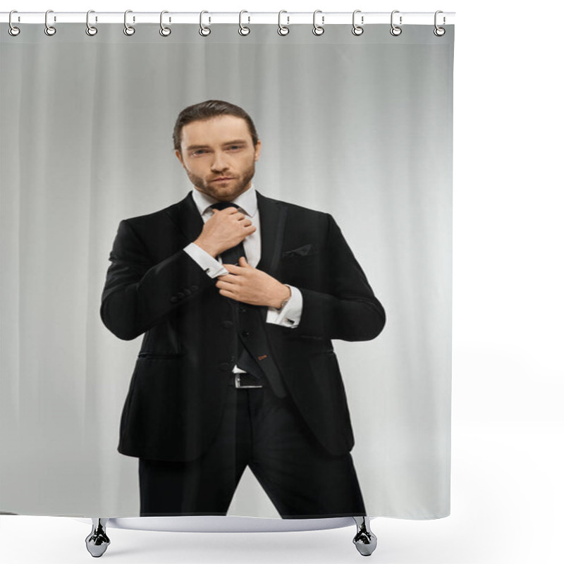 Personality  Bearded Businessman In A Suit Adjusting His Tie Against A Grey Studio Background. Shower Curtains