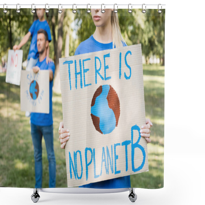 Personality  Woman Holding Placard With Globe And There Is No Planet B Inscription Near Family With Posters On Blurred Background, Ecology Concept Shower Curtains