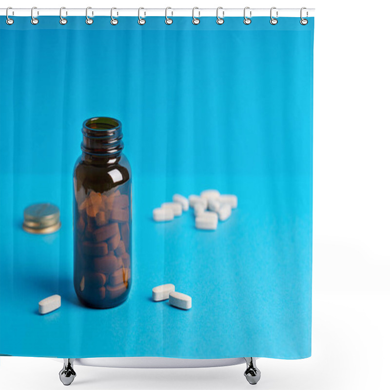 Personality  Tablets Or Pills Of Dietary Supplement Or Vitamins In Dark Brown Glass Bottle Container Against Blue Background Aimed To Prevent Disease. Image With Copy Space, Horizontal. Modern Color Concept Shower Curtains