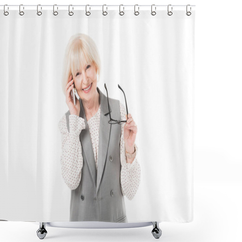 Personality  Smiling Senior Businesswoman Talking On Smartphone And Holding Eyeglasses Isolated On White Shower Curtains