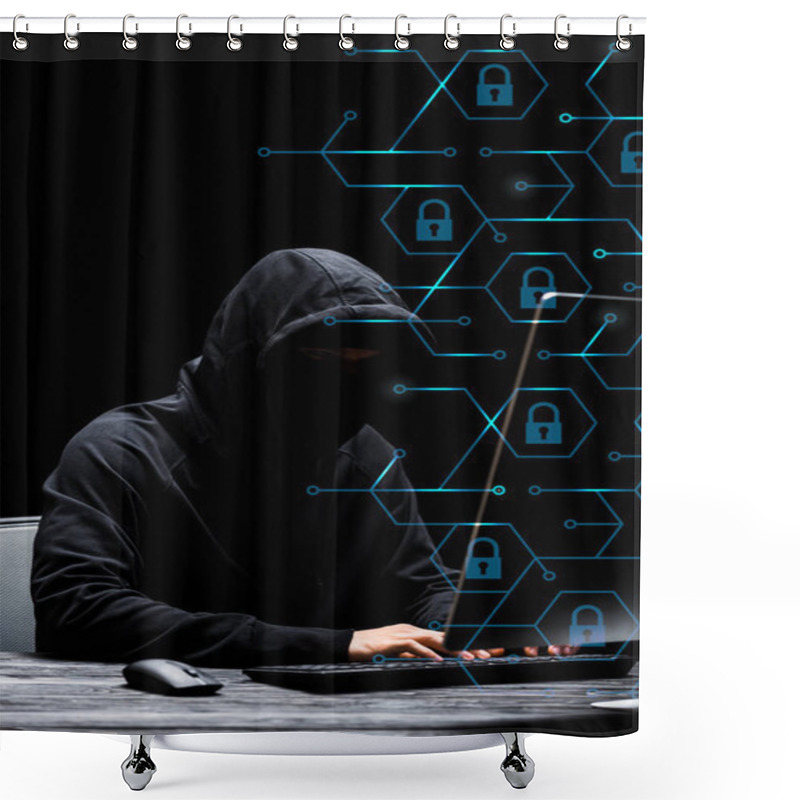 Personality  Hacker In Mask Sitting Near Computer Monitor And Typing On Computer Keyboard Near Padlocks On Black  Shower Curtains