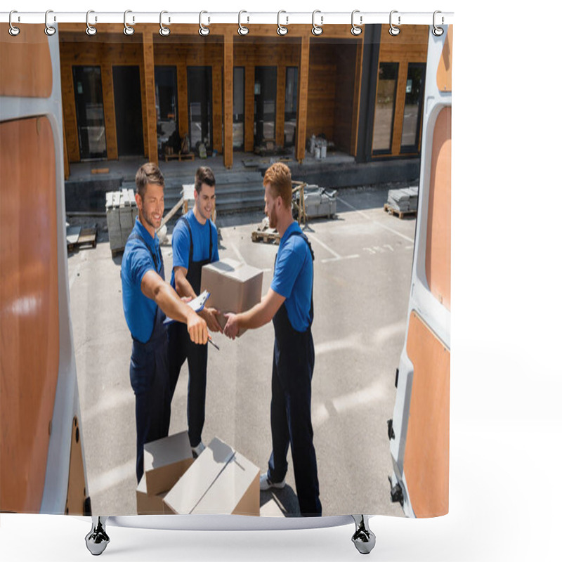 Personality  Selective Focus Of Loader With Clipboard And Pen Pointing With Hand Near Colleagues With Carton Boxes Beside Truck On Urban Street  Shower Curtains