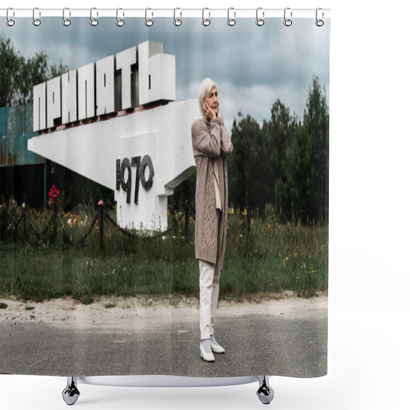 Personality  PRIPYAT, UKRAINE - AUGUST 15, 2019: Retired Woman Standing Near Monument With Pripyat Letters And Covering Ears  Shower Curtains