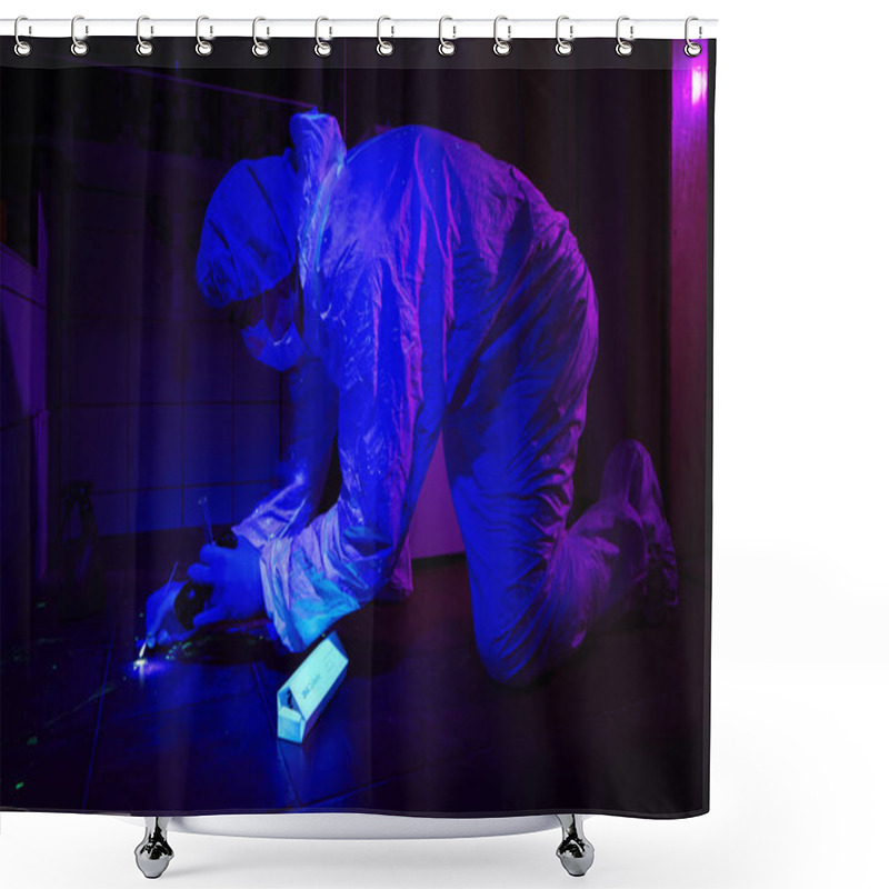 Personality  Criminologist Collecting DNA On Place Of Crime Under UV Light In Bathroom Shower Curtains