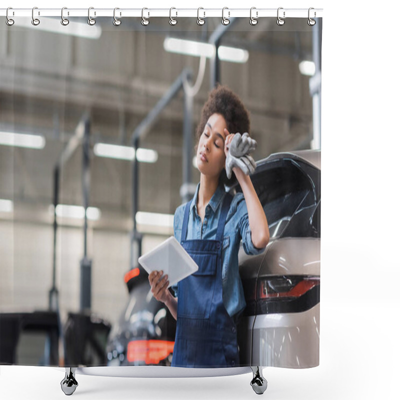 Personality  Tired Young African American Mechanic With Closed Eyes Standing With Digital Tablet And Holding Hand Near Head In Garage Shower Curtains