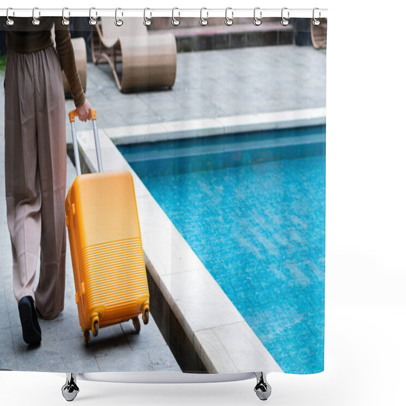 Personality  A Woman Walking By A Poolside With An Orange Suitcase, Wearing A Hat And Stylish Outfit. The Background Features Lush Greenery And A Wooden Structure, Creating A Tropical Vacation Vibe. Shower Curtains