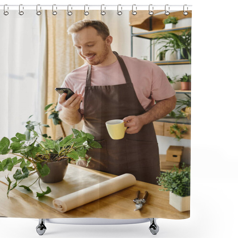 Personality  Man In Apron Holding Cup, Checking Phone In Small Plant Shop. Business Owner Multitasking During Busy Day. Shower Curtains