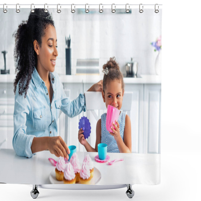 Personality  Cheerful African American Mother And Daughter With Tiaras Sitting At Table With Cupcakes In Kitchen Shower Curtains