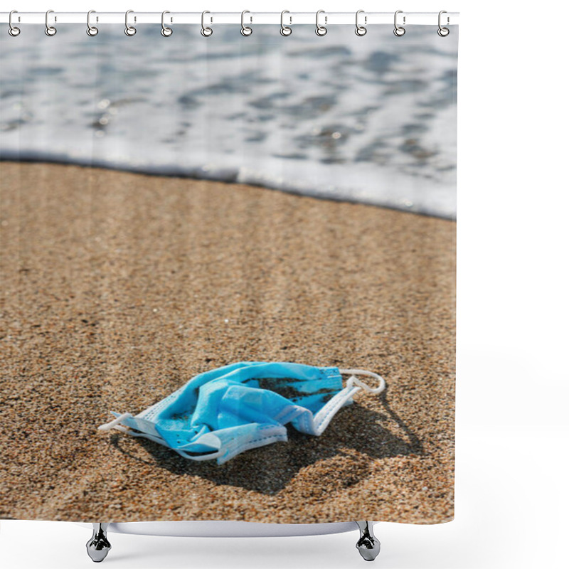 Personality  Closeup Of A Blue Used Surgical Mask Thrown On The Wet Sand Of The Seashore Of A Beach Shower Curtains