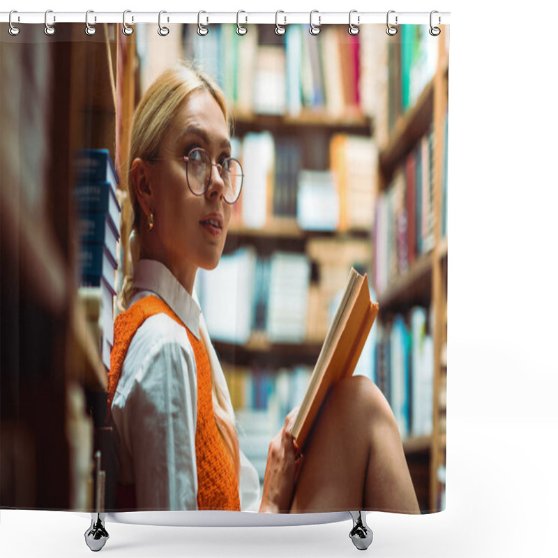 Personality  Beautiful And Blonde Woman In Glasses Holding Book And Looking Away In Library  Shower Curtains