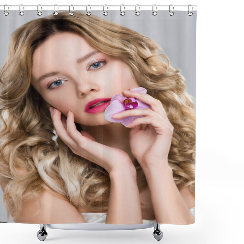 Personality  Young Blonde Gentle Woman Holding Purple Orchid In Hand While Touching Face Isolated On Grey Shower Curtains