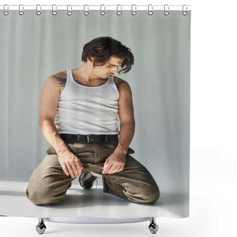 Personality  A Handsome Young Man Kneels In A Tank Top, Showcasing His Tattoo Against A Minimalist Grey Background. Shower Curtains