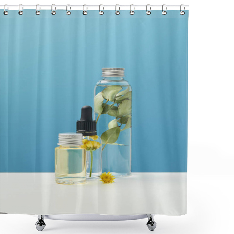 Personality  Organic Cosmetic Products With Green Leaves And Flowers In Transparent Bottles Isolated On Blue  Shower Curtains