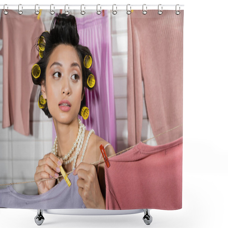 Personality  Pensive Young Asian Woman With Hair Curlers And Pearl Necklace Holding Clothes Pin And Hanging Clean And Wet Laundry With Blurred Background At Home, Housework, Housewife, Domestic Responsibilities  Shower Curtains