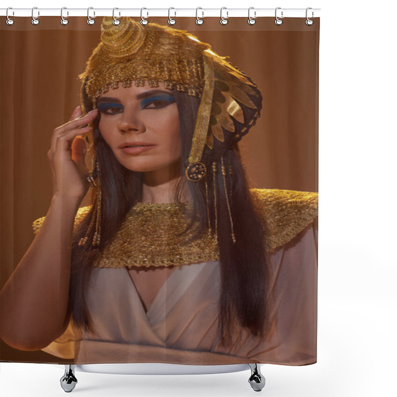 Personality  Portrait Of Brunette Woman In Traditional Egyptian Look And Bold Makeup Standing Isolated On Brown Shower Curtains