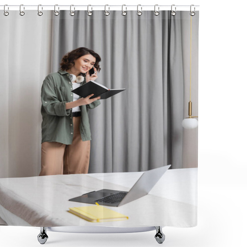 Personality  Freelance Lifestyle, Happy Woman With Wireless Headphones Looking At Notebook And Talking On Mobile Phone Near Grey Curtains, Wall Sconce, Laptop And Notepad On Comfortable Bed In Modern Hotel Room Shower Curtains