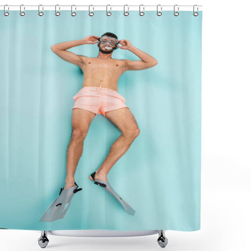 Personality  High Angle View Of Shirtless Man In Swimming Flippers And Goggles Lying On Blue Background  Shower Curtains