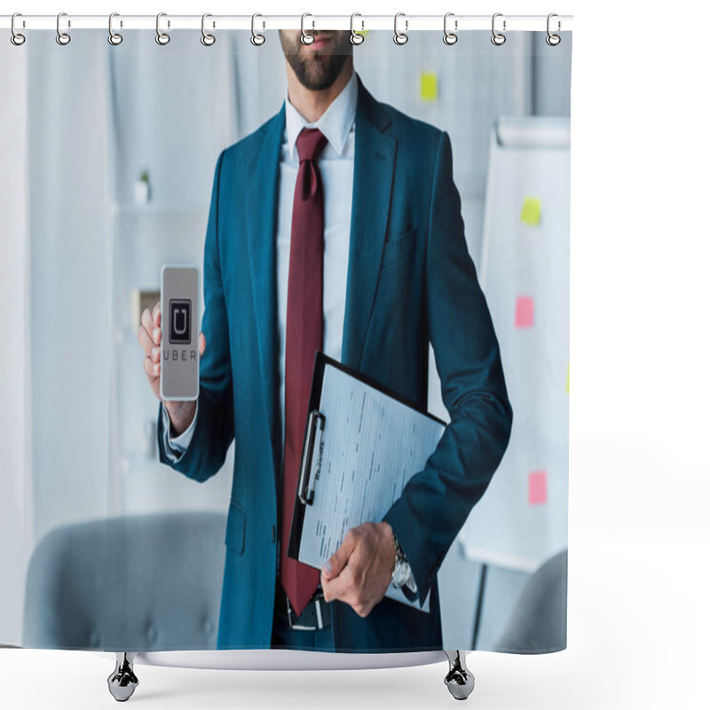 Personality  KYIV, UKRAINE - JUNE 10, 2019: Cropped View Of Bearded Man Holding Clipboard And Smartphone With Uber App On Screen  Shower Curtains