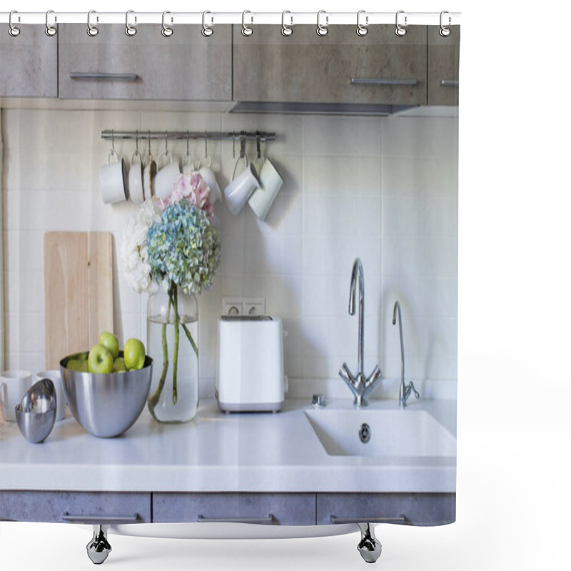 Personality  Kitchen In Beige Tones. Mugs And Milk Jugs Hang On Hooks. Sink With Taps. Steel Bowl With Green Apples. Bouquet Of Multi-colored Hydrangeas In A Glass Vase On A White Background On A Wooden Table. Shower Curtains