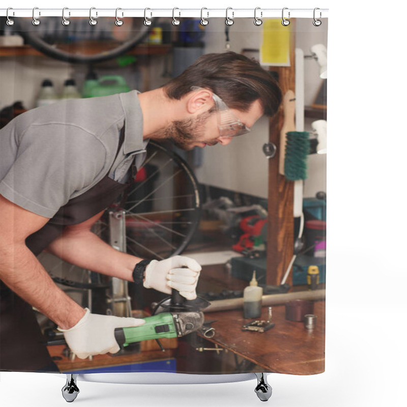 Personality  Side View Of Young Repairman In Protective Workwear Holding Angle Grinder In Workshop Shower Curtains