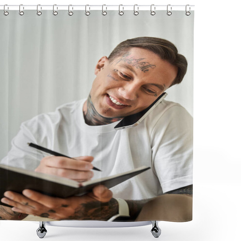 Personality  A Young Man Smiles As He Jots Down Ideas, Multitasking Between A Phone Call And Note Taking. Shower Curtains