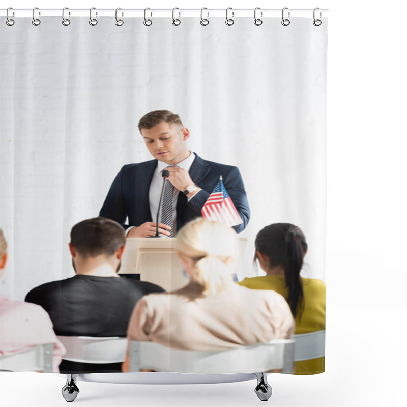 Personality  Confident Political Agitator Standing In Front Of Voters In Conference Hall, Blurred Foreground Shower Curtains