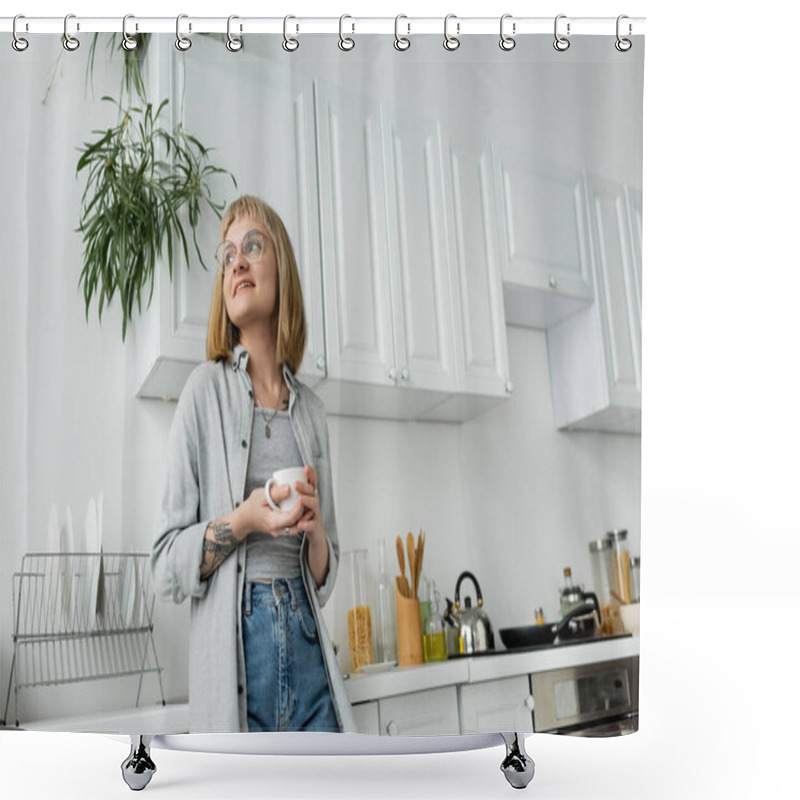 Personality  Joyful Young Woman With Short Hair And Bangs, Eyeglasses And Tattoo Holding Cup Of Morning Coffee While Looking Away And Standing In Casual Clothes Next To Dishes, Kettle, Kitchen Appliances  Shower Curtains