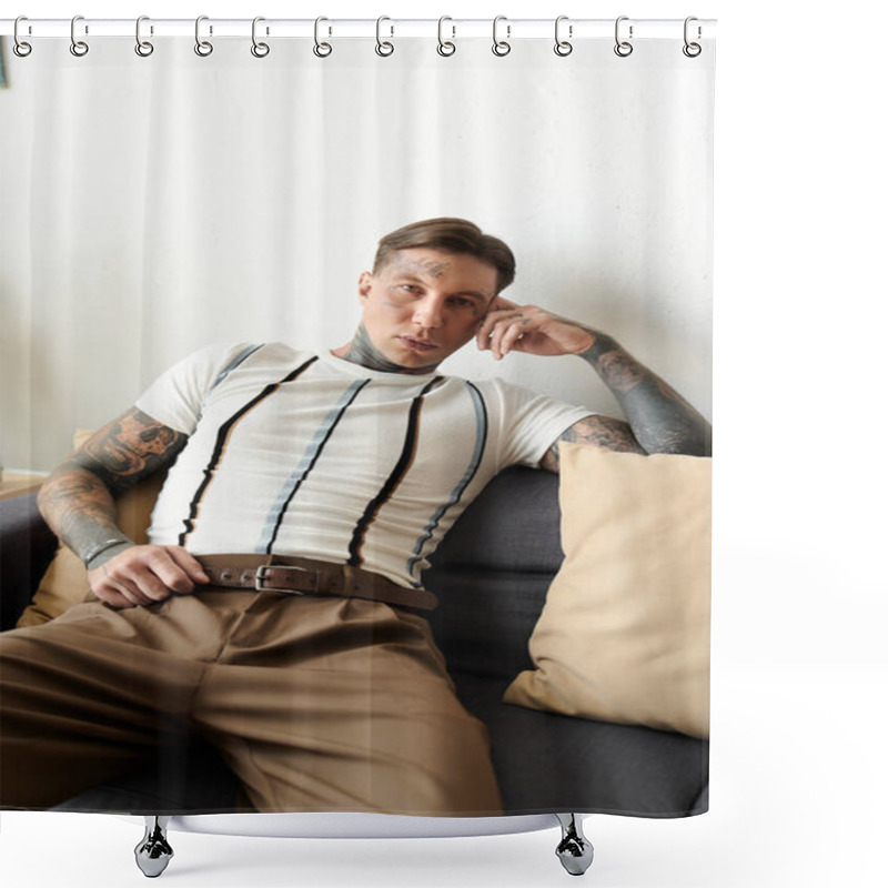 Personality  A Tattooed Young Man Relaxes Confidently On A Couch In A Modern Living Space. Shower Curtains