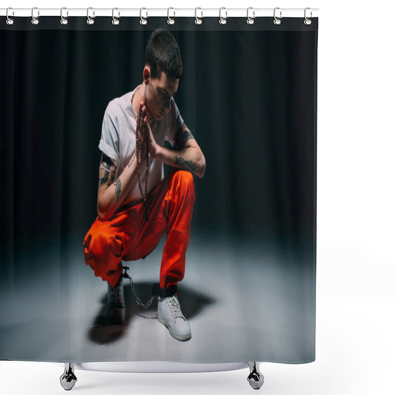 Personality  Sad Male Prisoner In Orange Pants And Cuffs Holding Rosary And Praying On Dark Background Shower Curtains