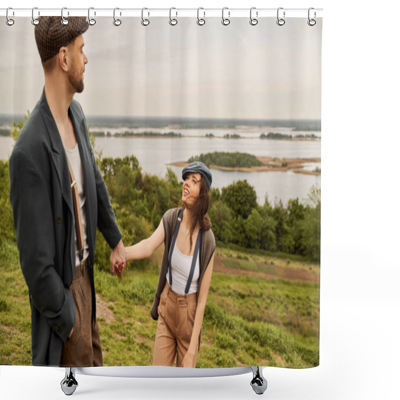 Personality  Cheerful And Fashionable Brunette Woman In Newsboy Cap And Suspenders Holding Hand Of Bearded Boyfriend In Jacket And Standing With Scenic Landscape At Background, Fashionable Couple In Countryside Shower Curtains