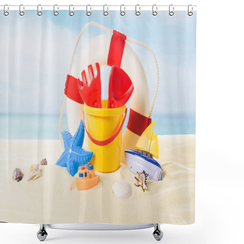 Personality  Life Ring And Beach Toys In Sand On Blue Sky Background Shower Curtains