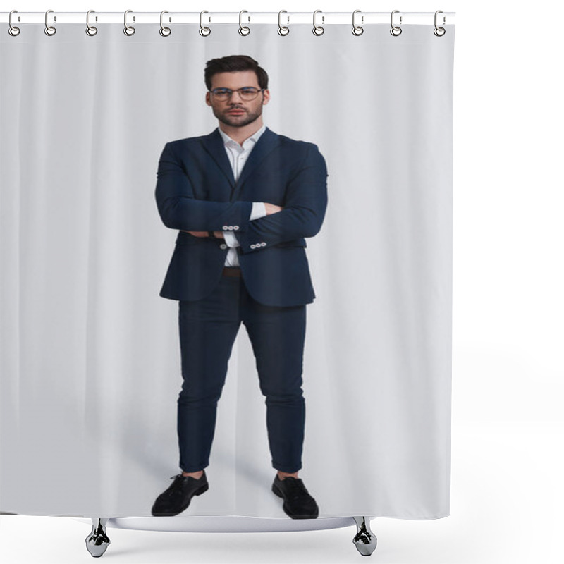 Personality  Confident Young Man In Full Suit Looking At Camera And Keeping Arms Crossed While Standing Against Grey Background Shower Curtains