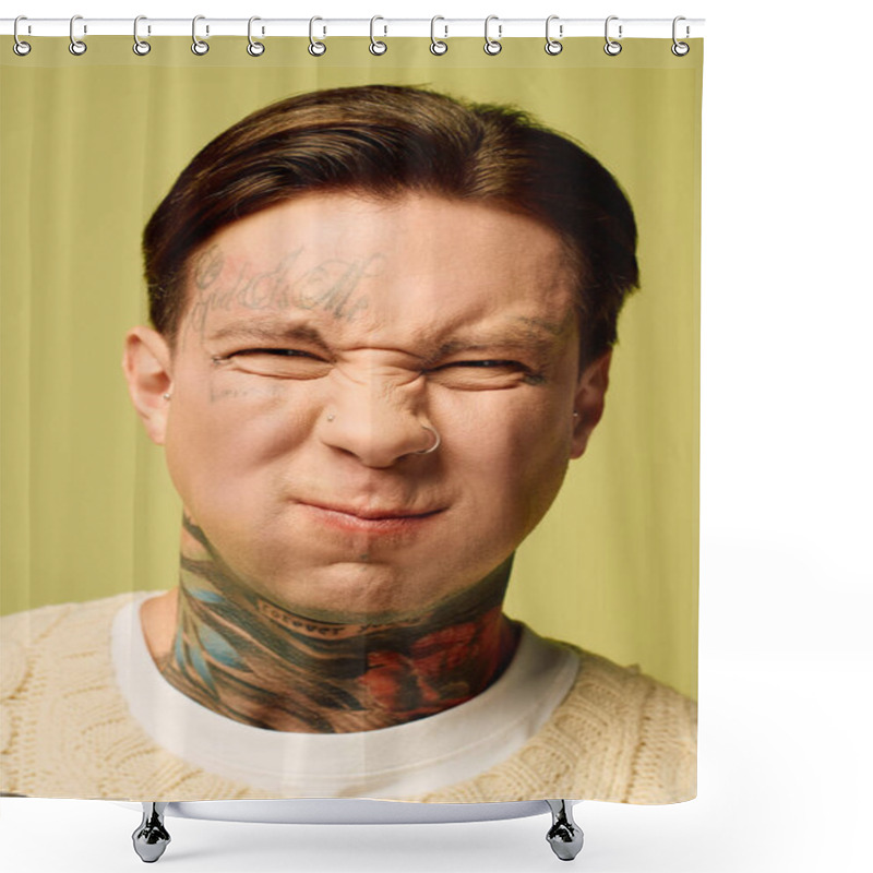 Personality  A Tattooed Young Man Playfully Scrunches His Face, His Ink Vivid Against A Green Backdrop. Shower Curtains