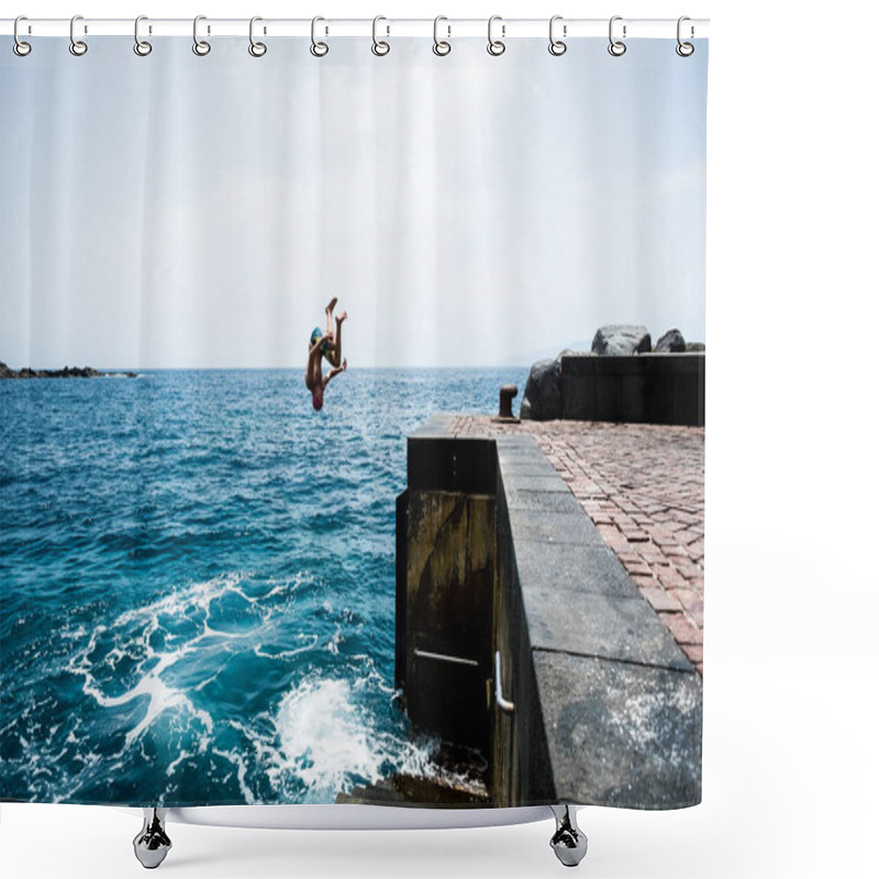 Personality  One Young And Happy Teenager Jumping Off A Cliff To The Water Of The Sea Or Ocean At A Hot Day Of Summer Enjoying At The Beach. Active And Beautiful Lifestyle Outdoors    Shower Curtains