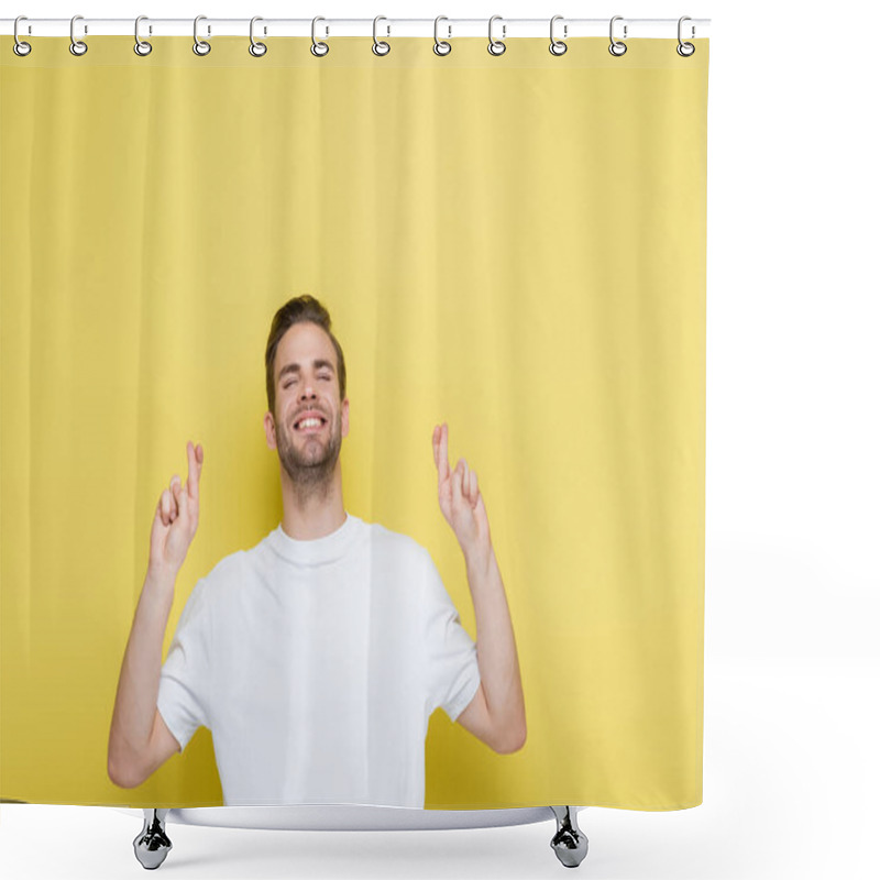 Personality  Cheerful Man With Closed Eyes Standing With Crossed Fingers On Yellow Shower Curtains