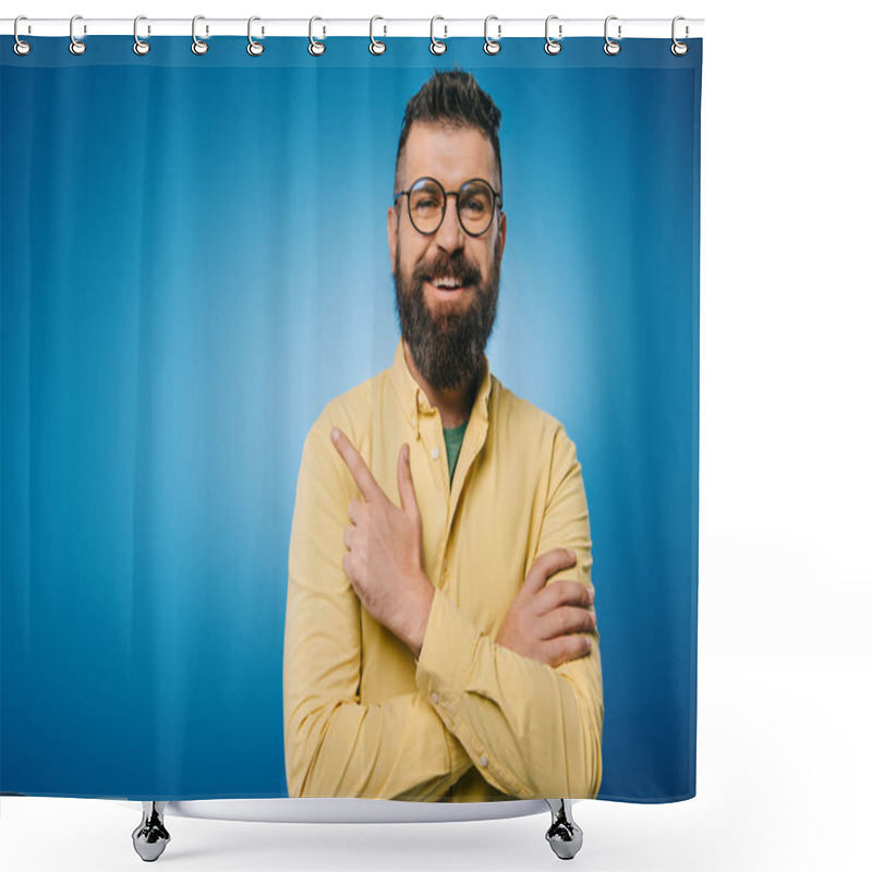 Personality  Cheerful Bearded Man In Eyeglasses Pointing Isolated On Blue Shower Curtains