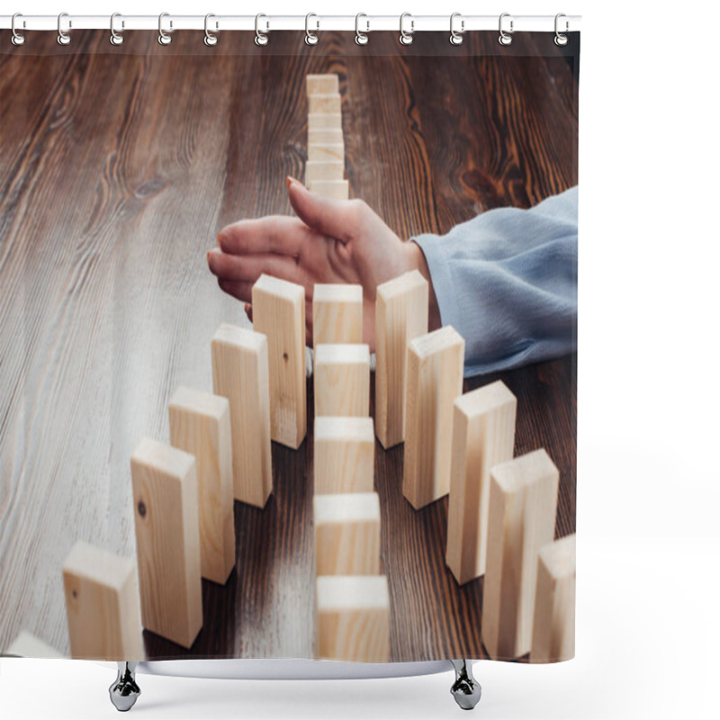 Personality  Selective Focus Of Woman Preventing Wooden Blocks From Falling Shower Curtains