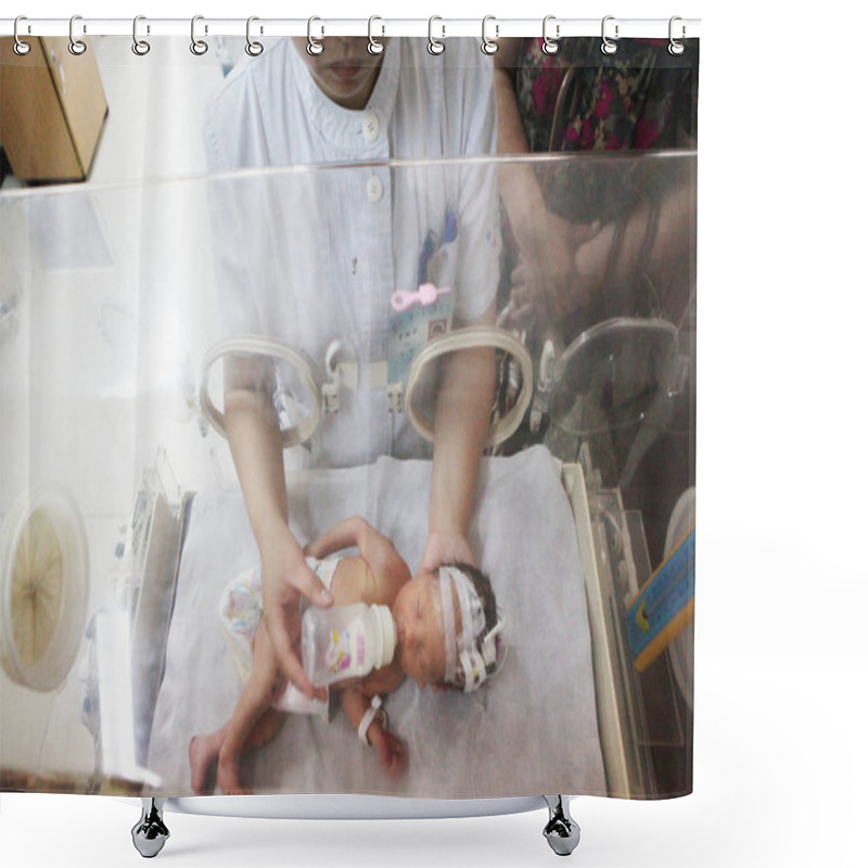 Personality  A Chinese Nurse Feeds Theinfant, Which Had Been Rescued From The Sewer Pipe In A Residential Building At A Hospital In Jinhua, East Chinas Zhejiang Province, 28 May 2013. Shower Curtains