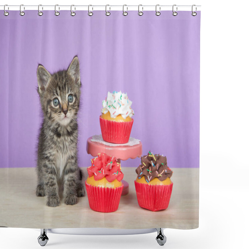 Personality  Close Up Portrait Of One Adorable Tabby Kitten Sitting On A Light Wood Floor Next To Pink Pedestal With Vanilla Frosted Cupcake. Light Lavender Purple Background. Shower Curtains