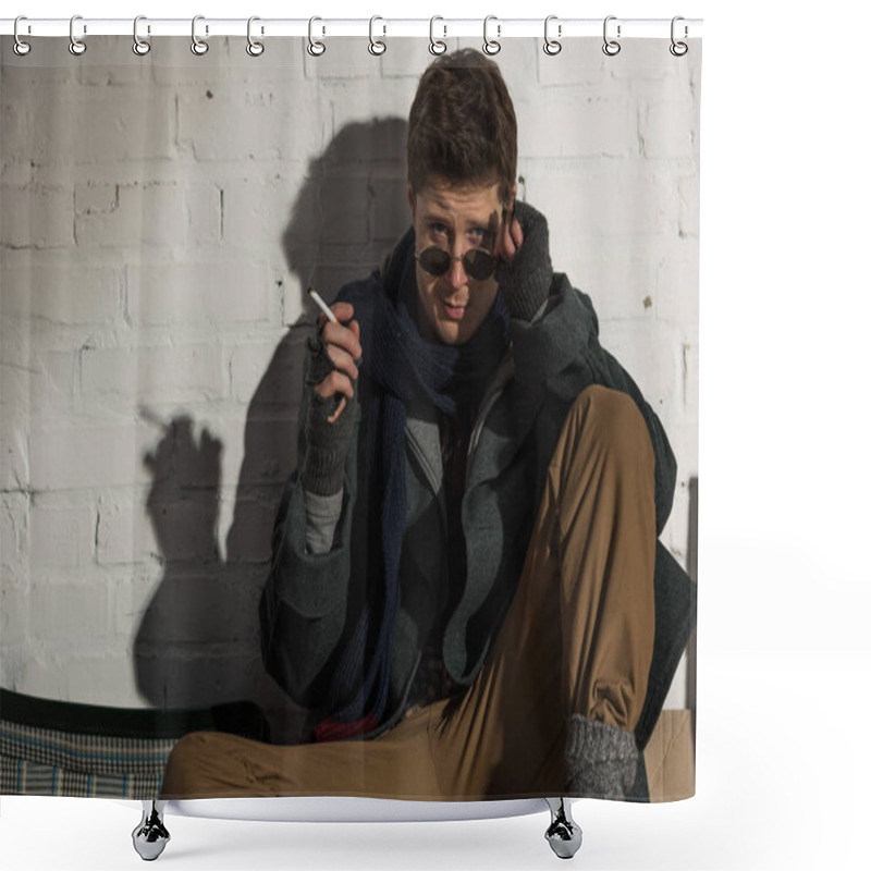 Personality  Homeless Man In Dark Glasses Smoking While Sitting By White Brick Wall  Shower Curtains