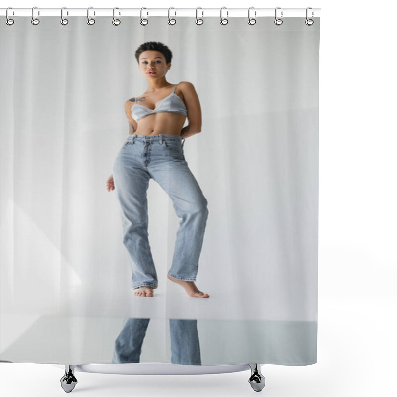 Personality  Full Length Of Barefoot Brunette Woman In Jeans And Bralette Standing Near Mirror On Floor On Grey Background Shower Curtains