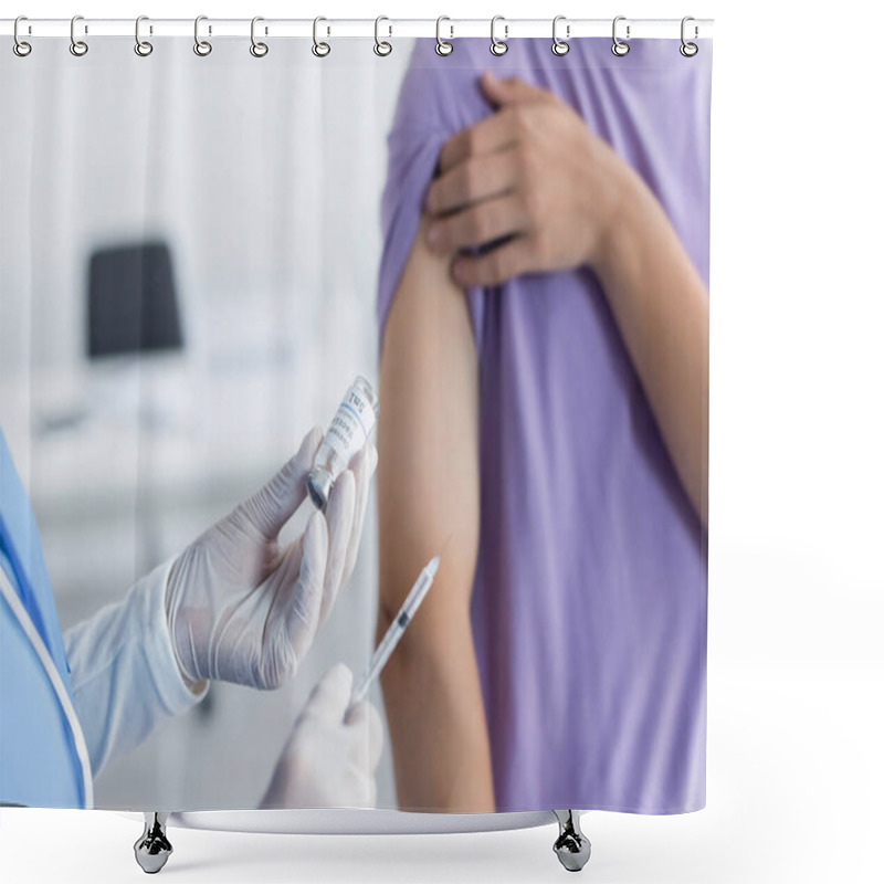 Personality  Cropped View Of Physician Holding Jar And Syringe With Vaccine Near Blurred Patient Shower Curtains