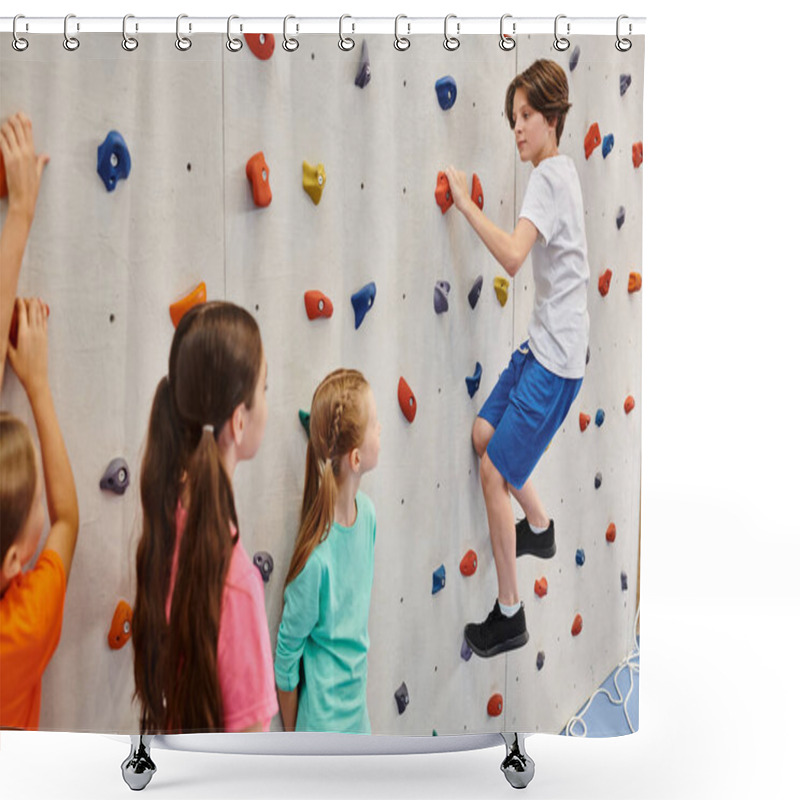 Personality  A Group Of Young Children Stand Together In Front Of A Climbing Wall, Listening Attentively To Their Teachers Instructions Before Attempting To Scale The Wall. Shower Curtains