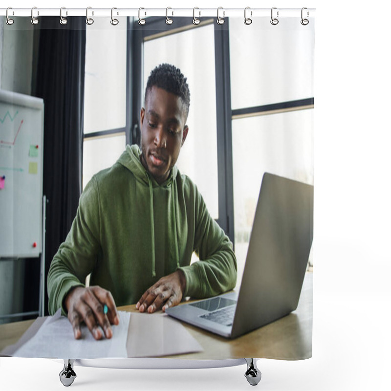 Personality  Young And Stylish African American Businessman Sitting At Workplace And Working With Documents Near Laptop And Flip Chart On Blurred Background In Office, Ambitious And Career Oriented Youth Shower Curtains