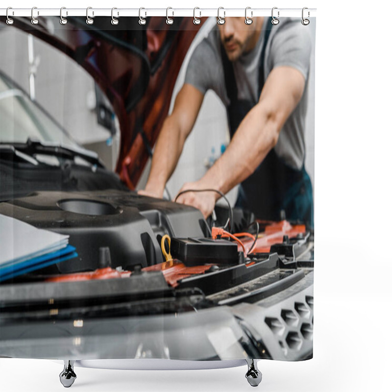 Personality  Cropped Shot Of Auto Mechanic With Multimeter Voltmeter Checking Car Battery Voltage At Mechanic Shop Shower Curtains